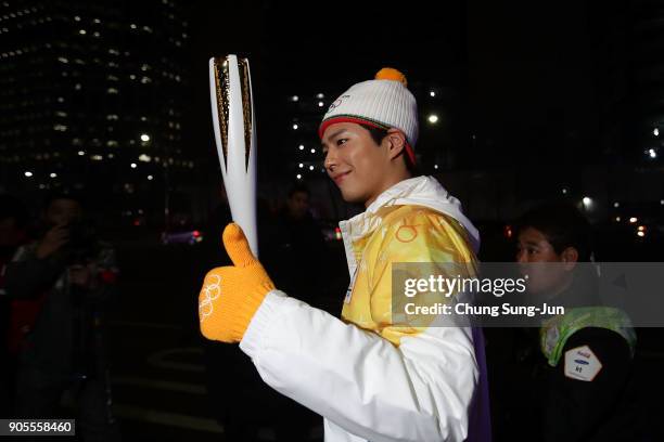 South Korean actor Park Bo-Gum holds the PyeongChang 2018 Winter Olympics torch during the PyeongChang 2018 Winter Olympic Games torch relay on...