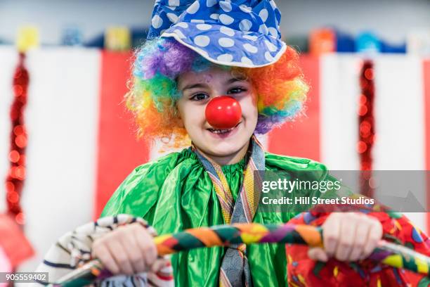 portrait of boy wearing clown costume - zirkus kinder stock-fotos und bilder