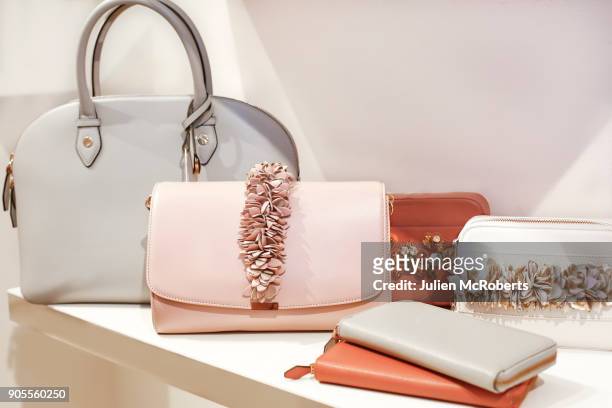 luxury purses on display - handtasche stock-fotos und bilder