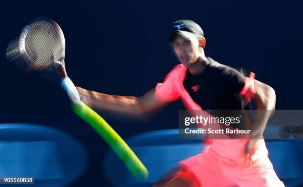 Alexei Popyrin of Australia plays a shot in his first round match against Tim Smyczek of the United States on day two of the 2018 Australian Open at...