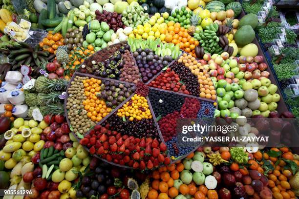 Fruits are put on display during the Horeca hospitality exhibition in Kuwait City on January 16, 2018. / AFP PHOTO / YASSER AL-ZAYYAT