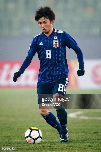 Tsukasa Morishima of Japan drives the ball during the AFC U-23 Championship Group B match between Japan and North Korea at Jiangyin Stadium on...