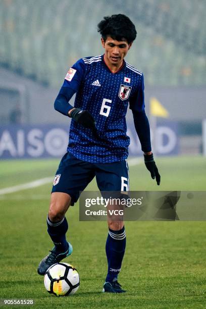 Yoichi Naganuma of Japan drives the ball during the AFC U-23 Championship Group B match between Japan and North Korea at Jiangyin Stadium on January...