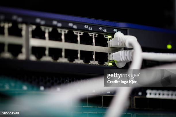 Connectors and LED lights of a server in a data room, on January 12, 2018 in Berlin, Germany.