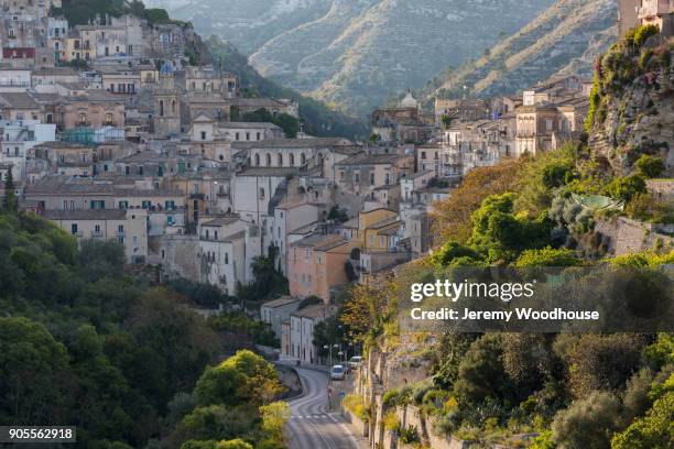 road and cityscape in mountains - ragusa sicily stock pictures, royalty-free photos & images