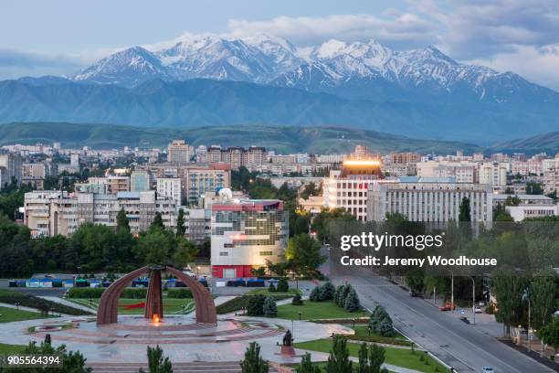 scenic view of cityscape and mountains - kyrgyzstan stock-fotos und bilder