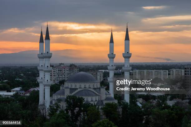 towers in cityscape at sunset - kyrgyzstan city stock pictures, royalty-free photos & images