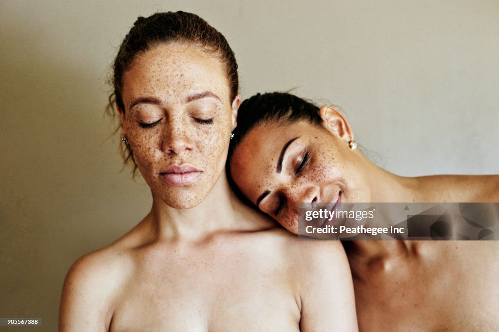 Close up of affectionate mixed race women