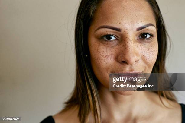 close up of smiling mixed race woman - mixed race woman stock-fotos und bilder