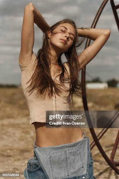 carefree caucasian woman wearing overalls - simferopol stock pictures, royalty-free photos & images