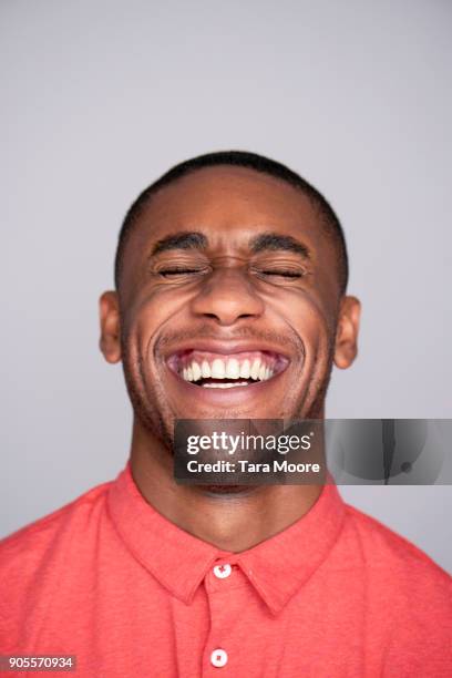 young man laughing - man laughing stock pictures, royalty-free photos & images