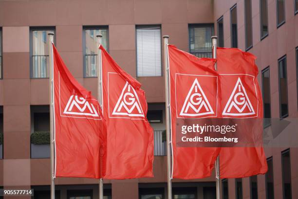 The IG Metall logo sits on banners flying outside the labor union's headquarter offices in Frankfurt, Germany, on Tuesday, Jan. 16, 2018. After years...