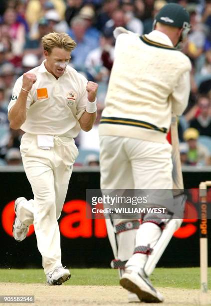 Australian paceman Andy Bichel celebrates dismissing South African batsman Nantie Haywood on the second day of the second Test Match being played at...