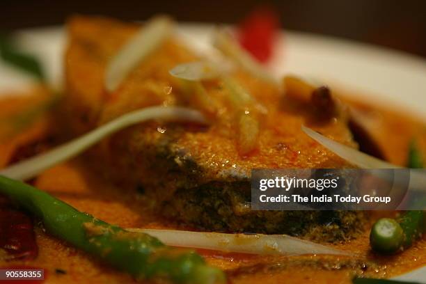 Hilsa fish with cucumber at Oh! Calcutta restaurant, New Delhi.