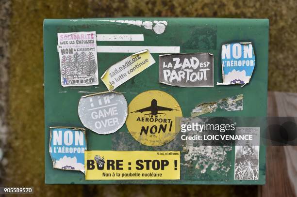 Picture taken on January 16, 2018 shows "anti airport" stickers on a mail box in the "Zad" of Notre-Dame-des-Landes, outside Nantes. The 'Zad' of...
