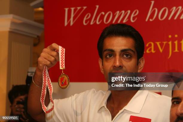 Manavjit Singh Sandhu with his Gold medal which he has won in 49th Shooting World Championship in Croatia. At Imperial hotel during a felicitation...