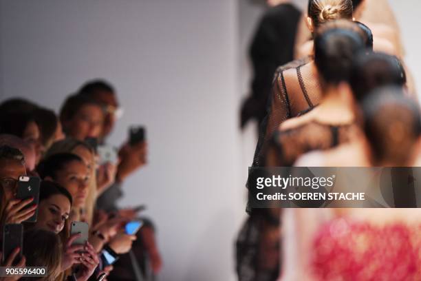 Model walk during the presentation of the collection of "Ewa Herzog" during the Berlin Fashion Week in Berlin on January 16, 2018. / AFP PHOTO / dpa...