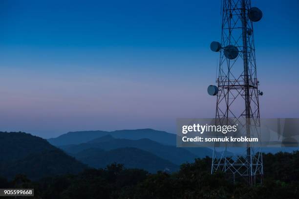 mountain range with commuication in twilight time after sun set - tower stock pictures, royalty-free photos & images