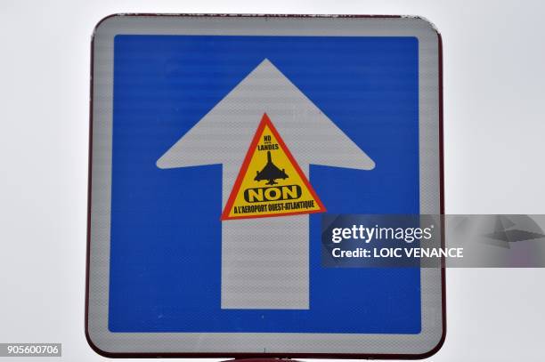 Picture taken on January 16, 2018 shows a sticker on a road sign reading "Notre-Dames des Landes - NO to the Western Atlantic airport" in the "Zad"...