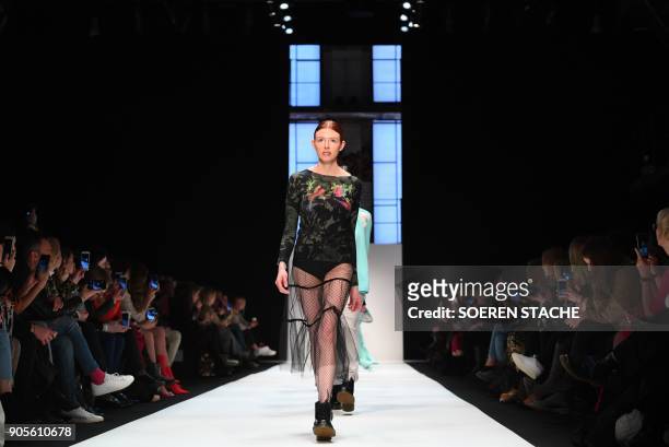 Model presents a creation by the Italian label "Cashmere Victim" during the Berlin Fashion Week in Berlin on January 16, 2018. / AFP PHOTO / dpa /...