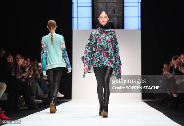 Model presents a creation by the Italian label "Cashmere Victim" during the Berlin Fashion Week in Berlin on January 16, 2018. / AFP PHOTO / dpa /...