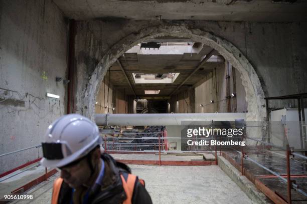 An attendee stands inside a tunnel during a tour of the Paris Metro subway railway line 12 Grand Paris expansion project being undertaken by Vinci SA...