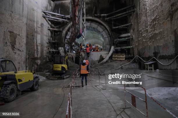 Attendees pass through a tunnel during a tour of the Paris Metro subway railway line 12 Grand Paris expansion project being undertaken by Vinci SA in...