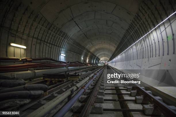 Railway tracks and pipework sit inside a tunnel during a tour of the Paris Metro subway railway line 12 Grand Paris expansion project being...