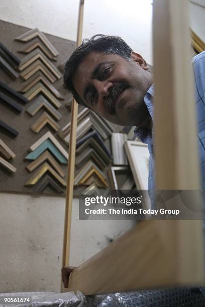 Murti Ahuja, framer and owner of Ahuja Framers in Paharganj, New Delhi.