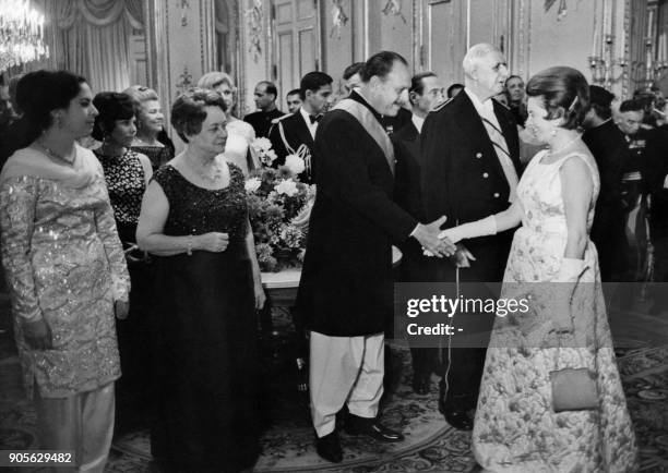 President of Pakistan Muhammed Ayub Khan shakes hand with the wife of Pierre Billotte, Minister of Overseas Departments and Territories, during a...