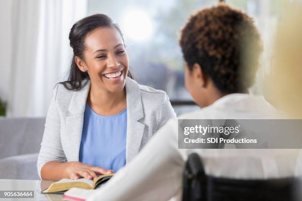 cheerful women participate in bible study - christian spirituality stock pictures, royalty-free photos & images