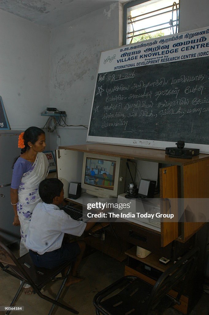 Villagers learning Computer, Farmers Knowing Weather, Womens Self Help Groups maintaining their Milk Dairy Accounts, Computer Classes in Progress for villagers, Villagers looking at the Weather Forecast Computer image, Villagers knowing the price of Veget