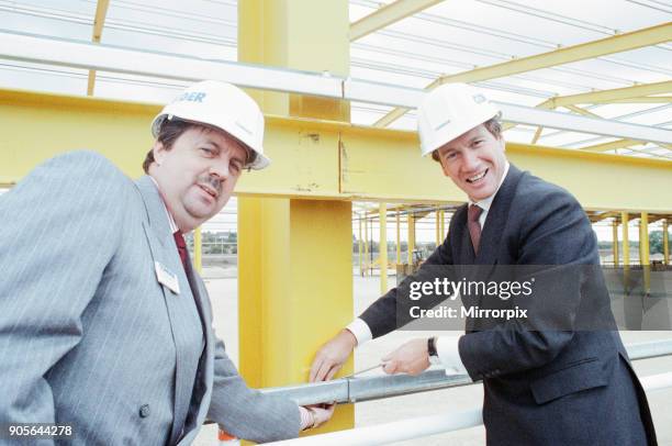 Local Government and Inner Cities Minister Michael Portillo unveils a plaque to mark the opening of the Teesside Park Interchange, with him is Ron...