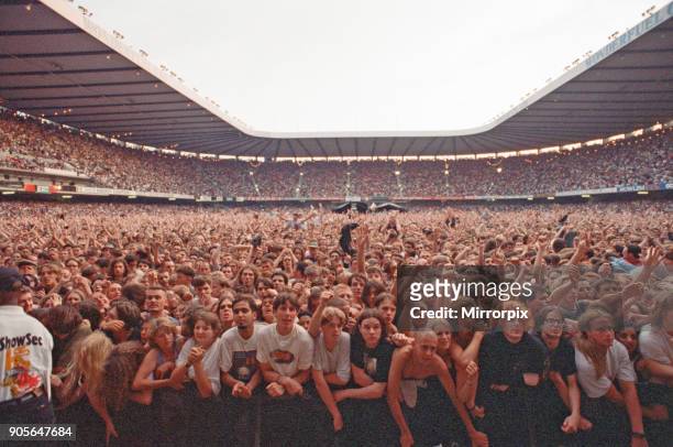 The huge audience watch American Rock Group REM, and Del Amitri perform at Cardiff Arms Park, Cardiff, Wales, on Sunday 23rd July 1995.