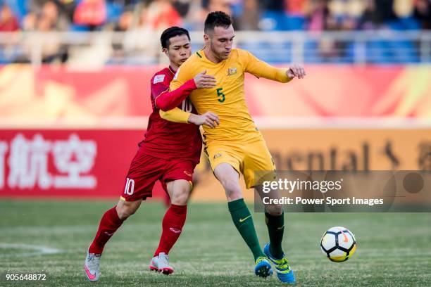 Aleksandar Susnjar of Australia fights for the ball with Nguyen Cong Phuong of Vietnam during the AFC U23 Championship China 2018 Group D match...