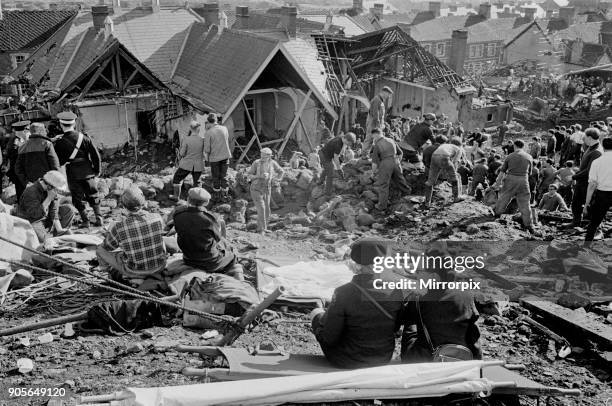 Aberfan, South Wales, circa October 1966: Picture shows the mud and devastation caused when mining spoil from the hillside high above the town behind...