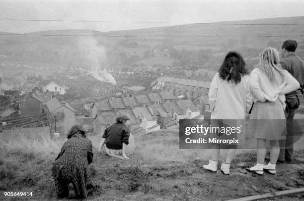 Aberfan - 21st October 1966: Children on the hillside overlooking Aberfan, watch as a bonfire is made near to where the mud slide has come to a halt,...