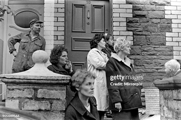 Aberfan, South Wales, circa October 1966: Picture shows shocked on lookers, looking towards the school and the the mud and devastation caused when...