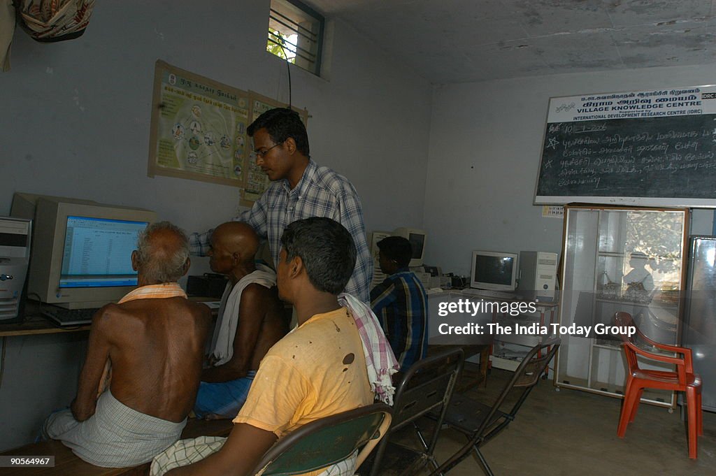 Villagers learning Computer, Farmers Knowing Weather, Womens Self Help Groups maintaining their Milk Dairy Accounts, Computer Classes in Progress for villagers, Villagers looking at the Weather Forecast Computer image, Villagers knowing the price of Veget
