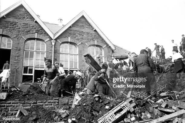 Aberfan, South Wales, circa October 1966: Picture shows the mud and devastation caused when mining spoil from the hillside high above the town behind...