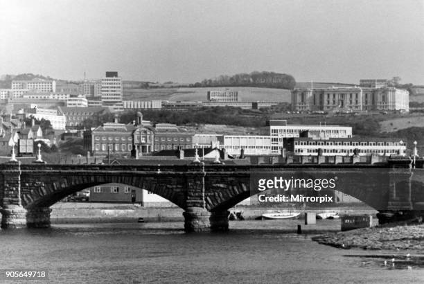 Aberystwyth Ceredigion, West Wales, 4th April 1967. A view up the estuary from Aberystwyth harbour, showing Trefechan bridge, with the University...