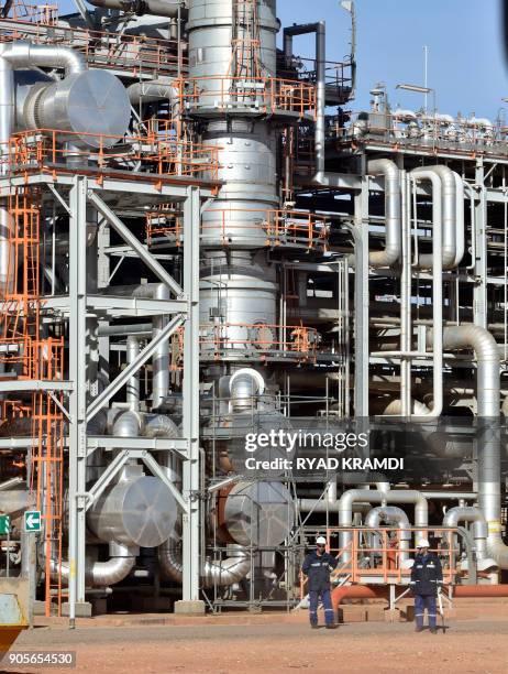 Picture taken on January 16, 2018 at In Amenas gas plant 300 kilometres southeast of Algiers, shows workers at the site during a ceremony to mark...