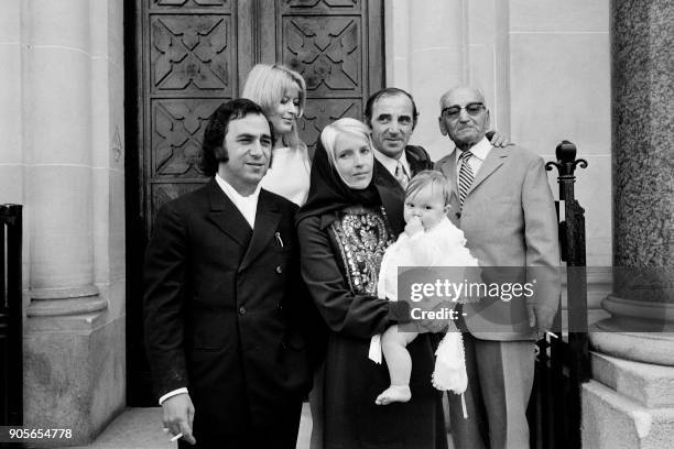 Armenian-French composer Georges Garvarentz, Renée Thorsell, French singer Charles Aznavour, his wife Ulla Thorsell holding their daughter Katia and...