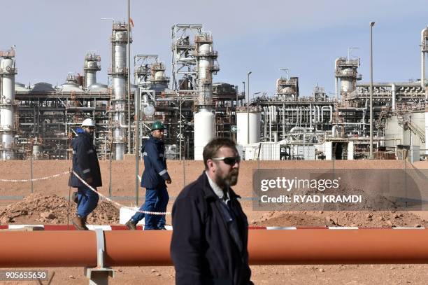 Picture taken on January 16, 2018 at In Amenas gas plant 300 kilometres southeast of Algiers, shows workers at the site during a ceremony to mark...