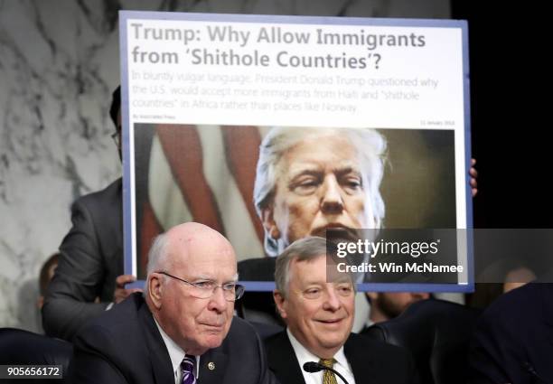 As Sen. Richard Durbin looks on, Sen. Patrick Leahy questions Homeland Security Secretary Kirstjen Nielsen during a hearing held by the Senate...