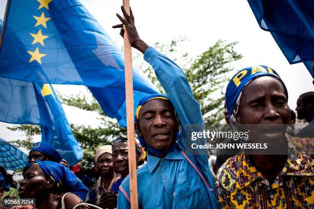 Supporters of the current President of the Democratic Republic of the Congo sing and dance during celebrations marking the 17th anniversary of the...