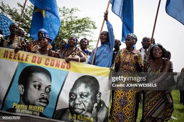 Supporters of the current President of the Democratic Republic of the Congo sing and dance during celebrations marking the 17th anniversary of the...
