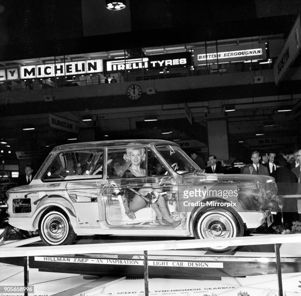 Model Caron gardner sits inside a Hillman Imp built of perspex to show the interior works at the Earls Court Motor show 15th October 1963.