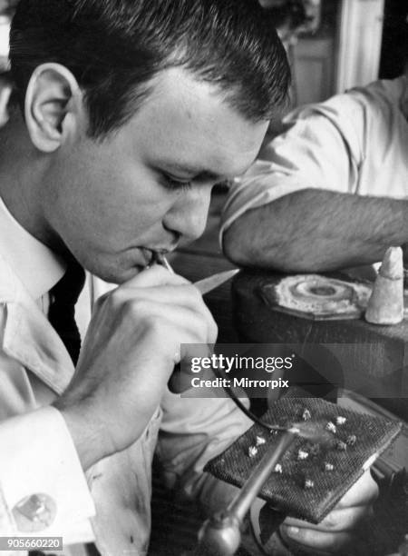 Derek Radford, apprentice Jeweller with Eaton and Wrighton, pictured busy at work in Workshop located in the Jewellery Quarter of Birmingham, 18th...