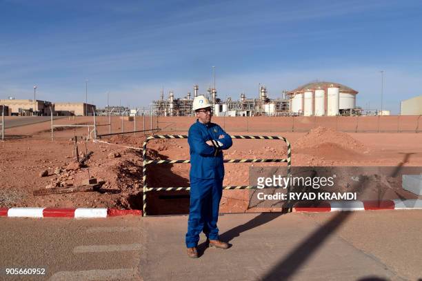 Picture taken on January 16, 2018 at In Amenas gas plant 300 kilometres southeast of Algiers, shows a worker at the site following a ceremony to mark...